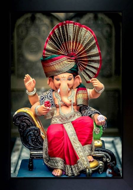 Ganapati puja with modaks and flowers